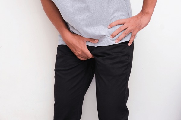 man-hand-holding-his-crotch-600nw-2385910741